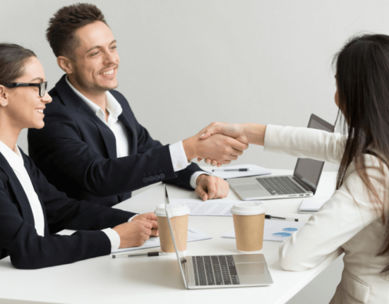 people shaking hands after a Sponsored posts deal