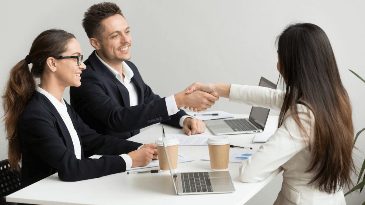 people shaking hands after a Sponsored posts deal
